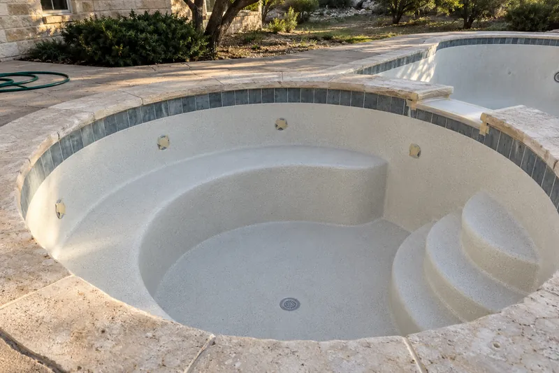 Drained spa with a fresh finish on its bench seats